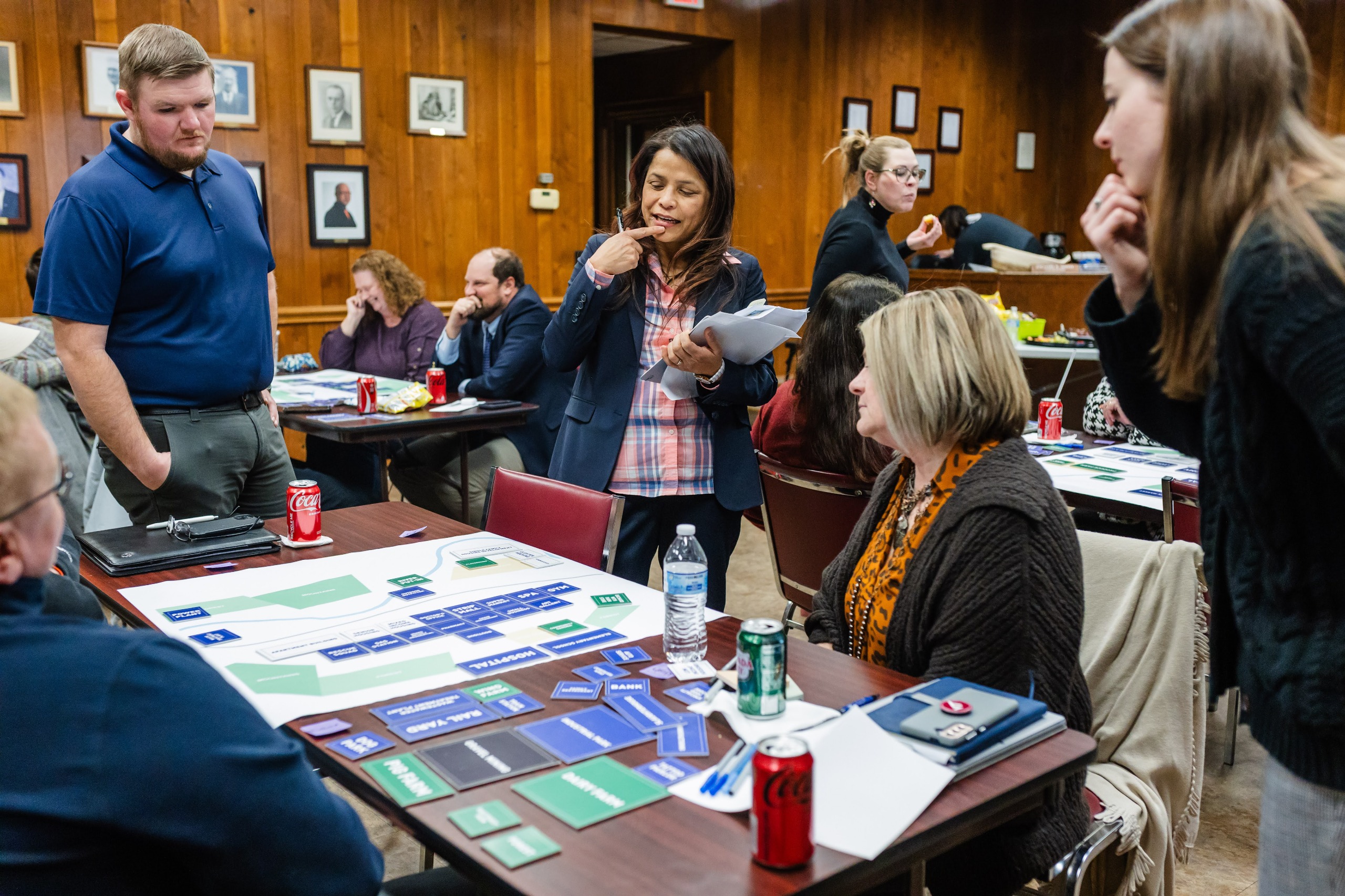 Group of people brainstorming around a table